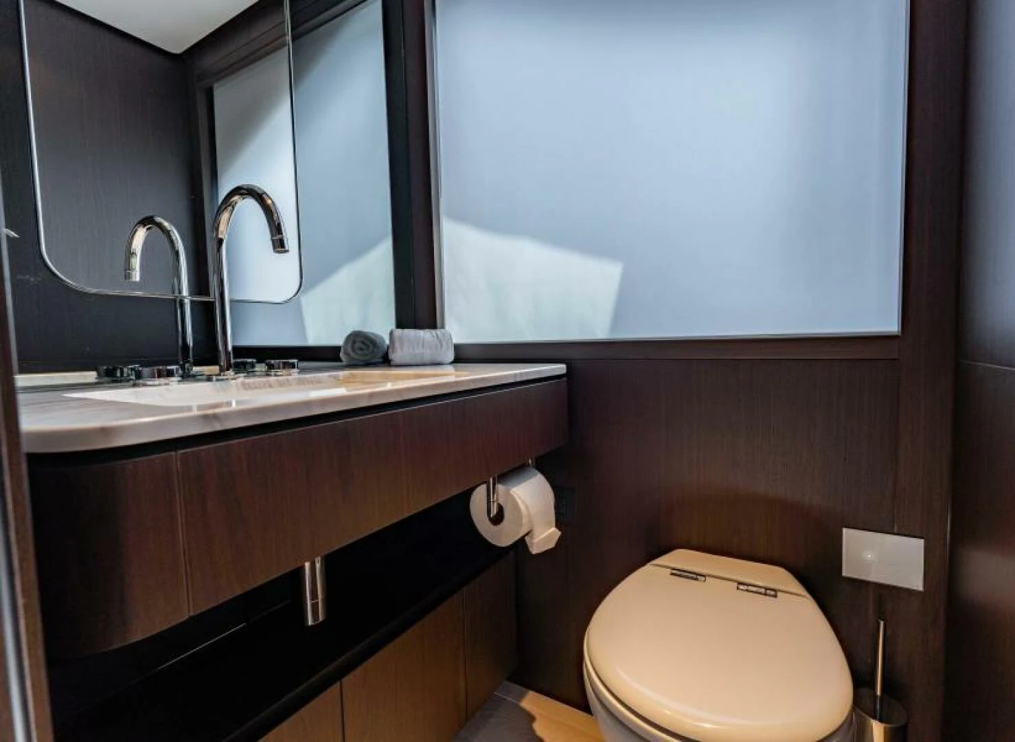 a bathroom with a toilet and a sink aboard INEA Yacht for Sale