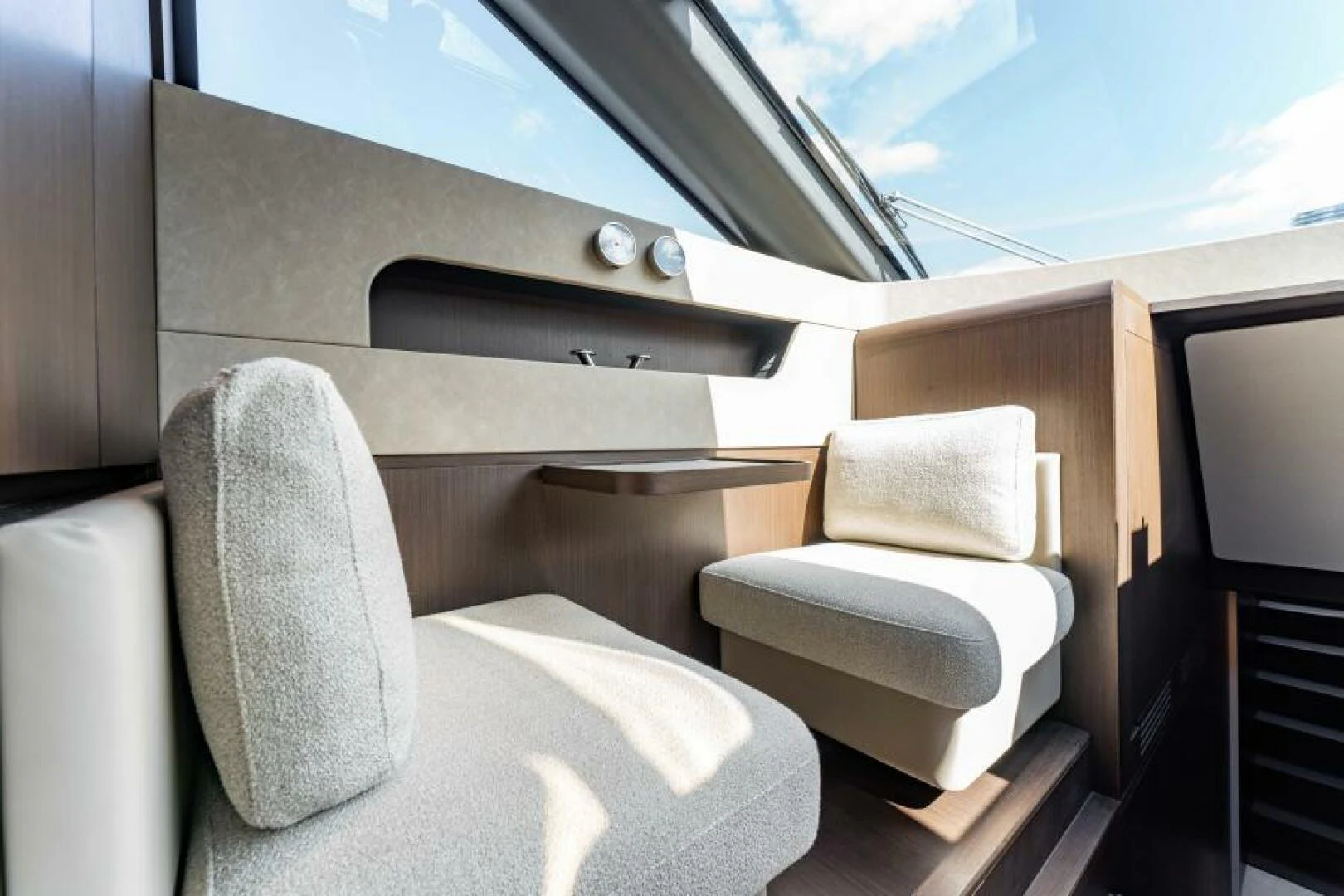 a room with a couch and a window aboard INEA Yacht for Sale