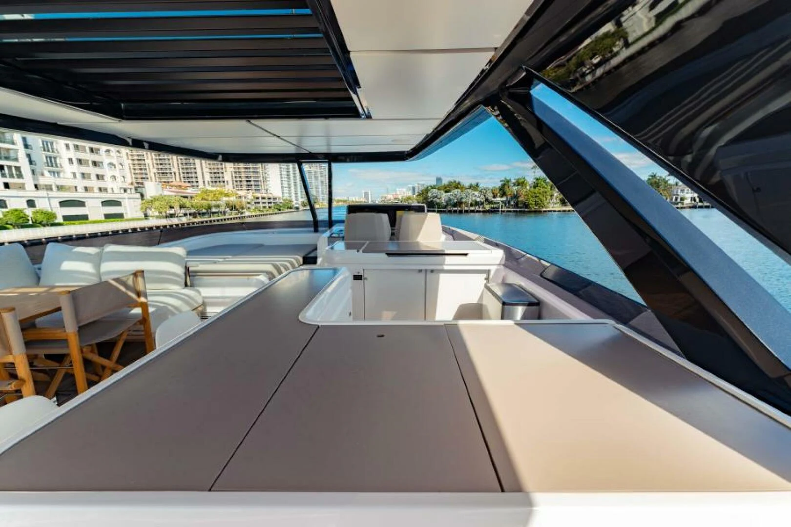 a pool with a deck and chairs aboard INEA Yacht for Sale