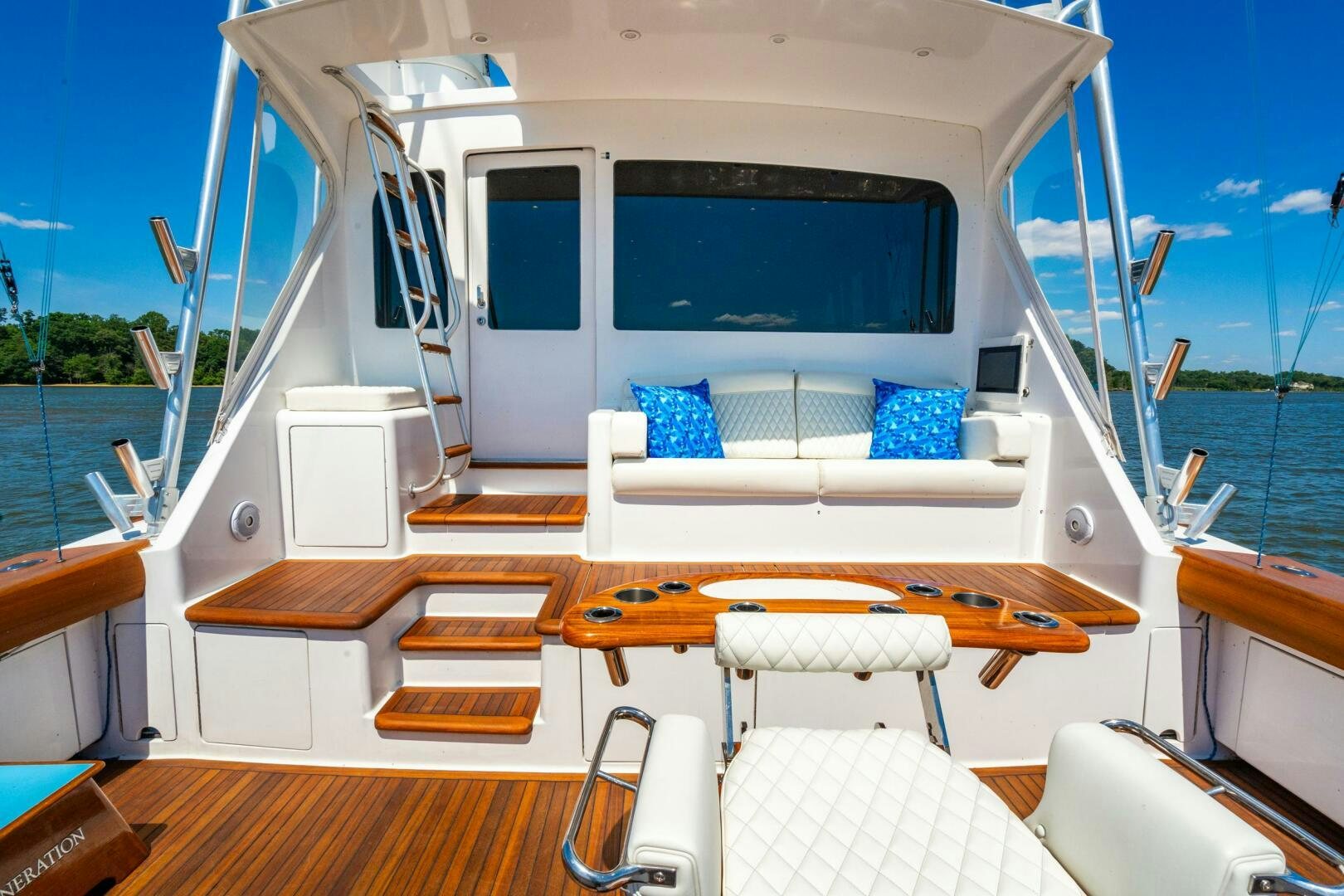 a boat with a deck and chairs aboard W Yacht for Sale