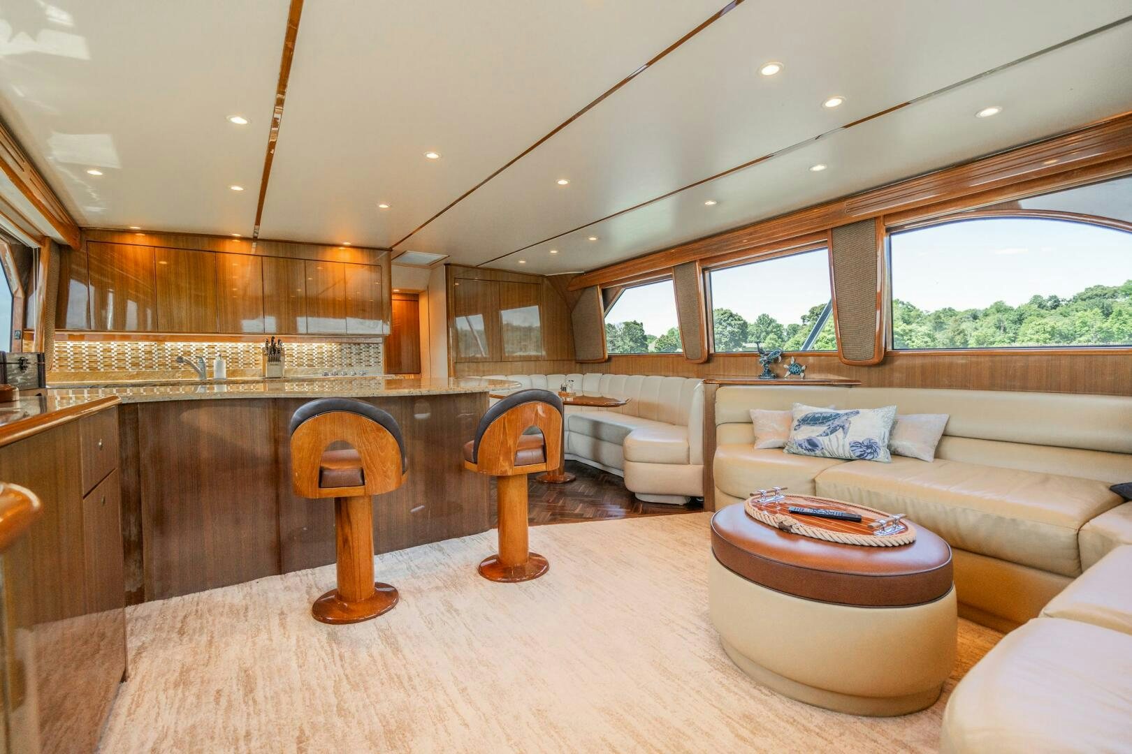a living room with a couch and a table aboard W Yacht for Sale