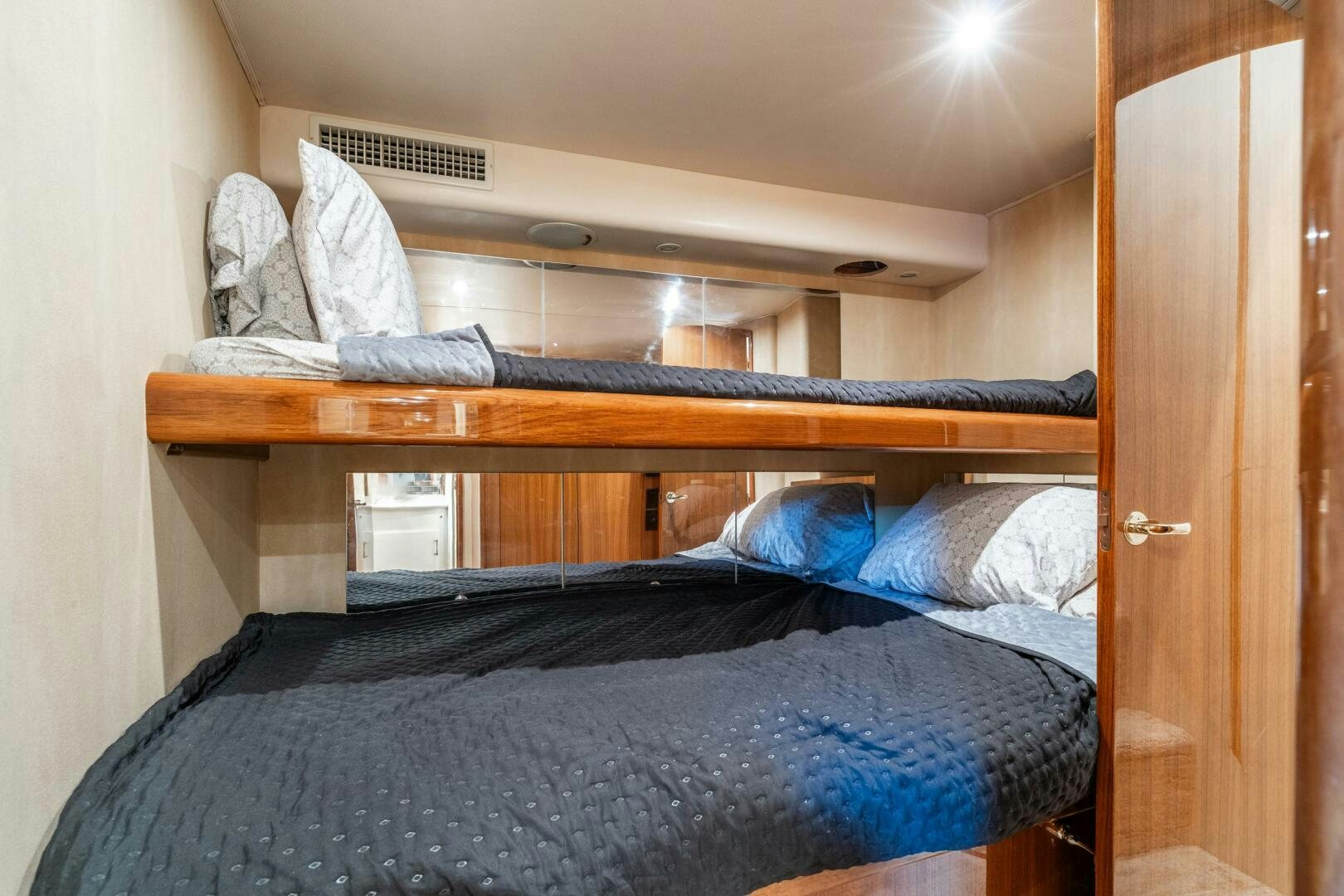 a person sleeping on a bunk bed aboard W Yacht for Sale