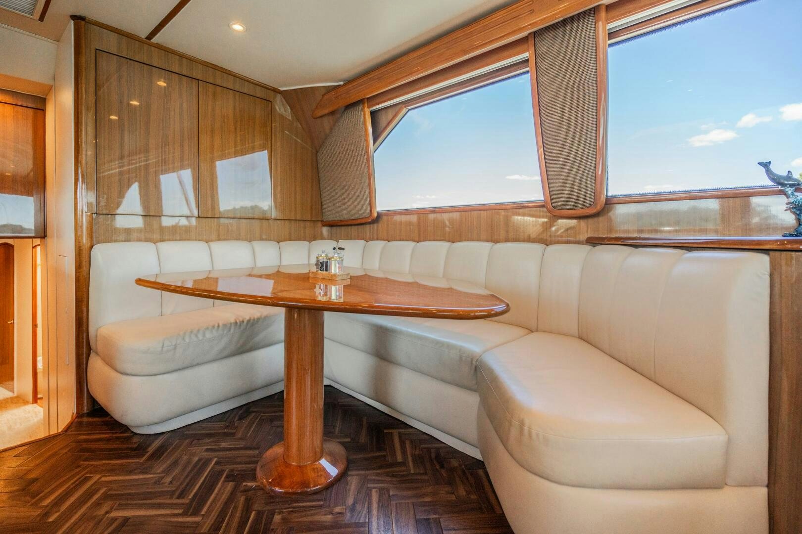 a living room with a couch and a table aboard W Yacht for Sale