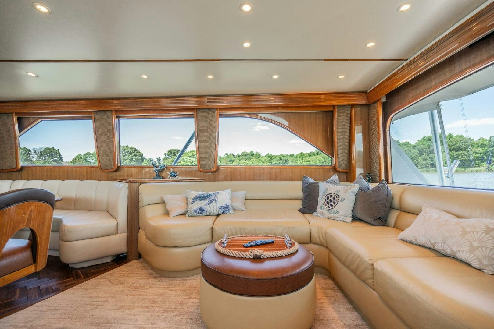 a living room with a couch and a table aboard W Yacht for Sale