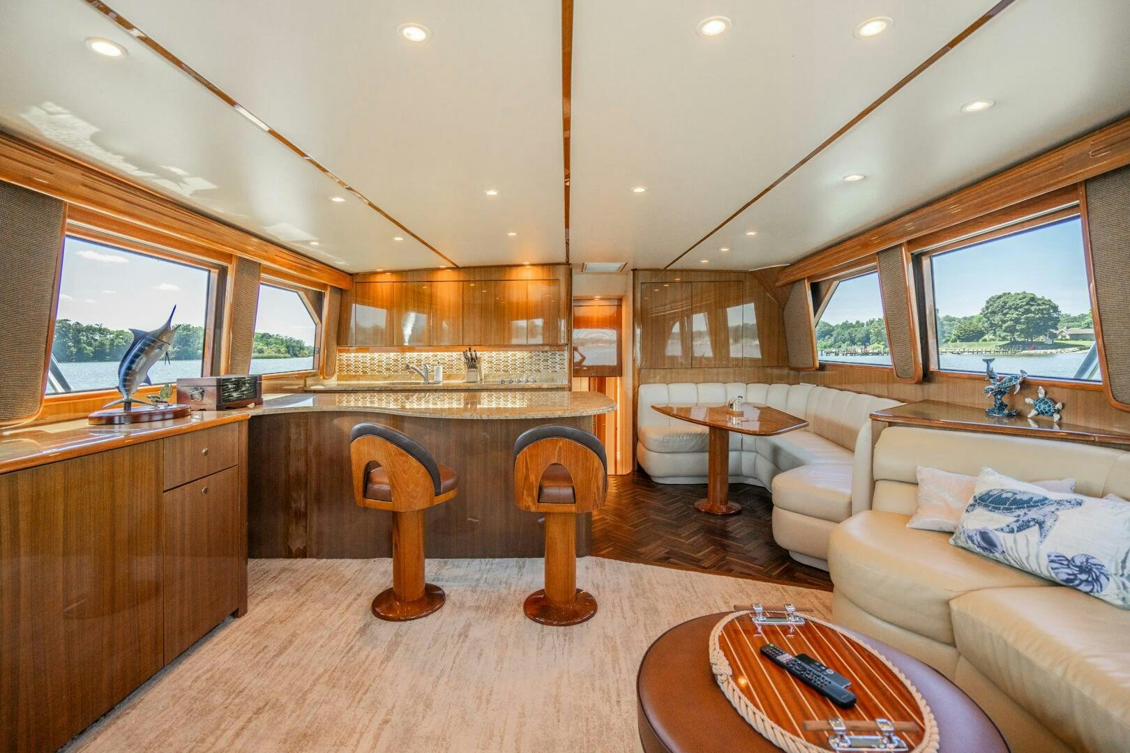 a living room with a wood table aboard W Yacht for Sale