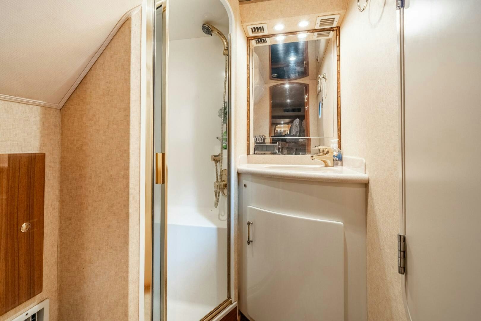 a bathroom with a glass shower aboard W Yacht for Sale
