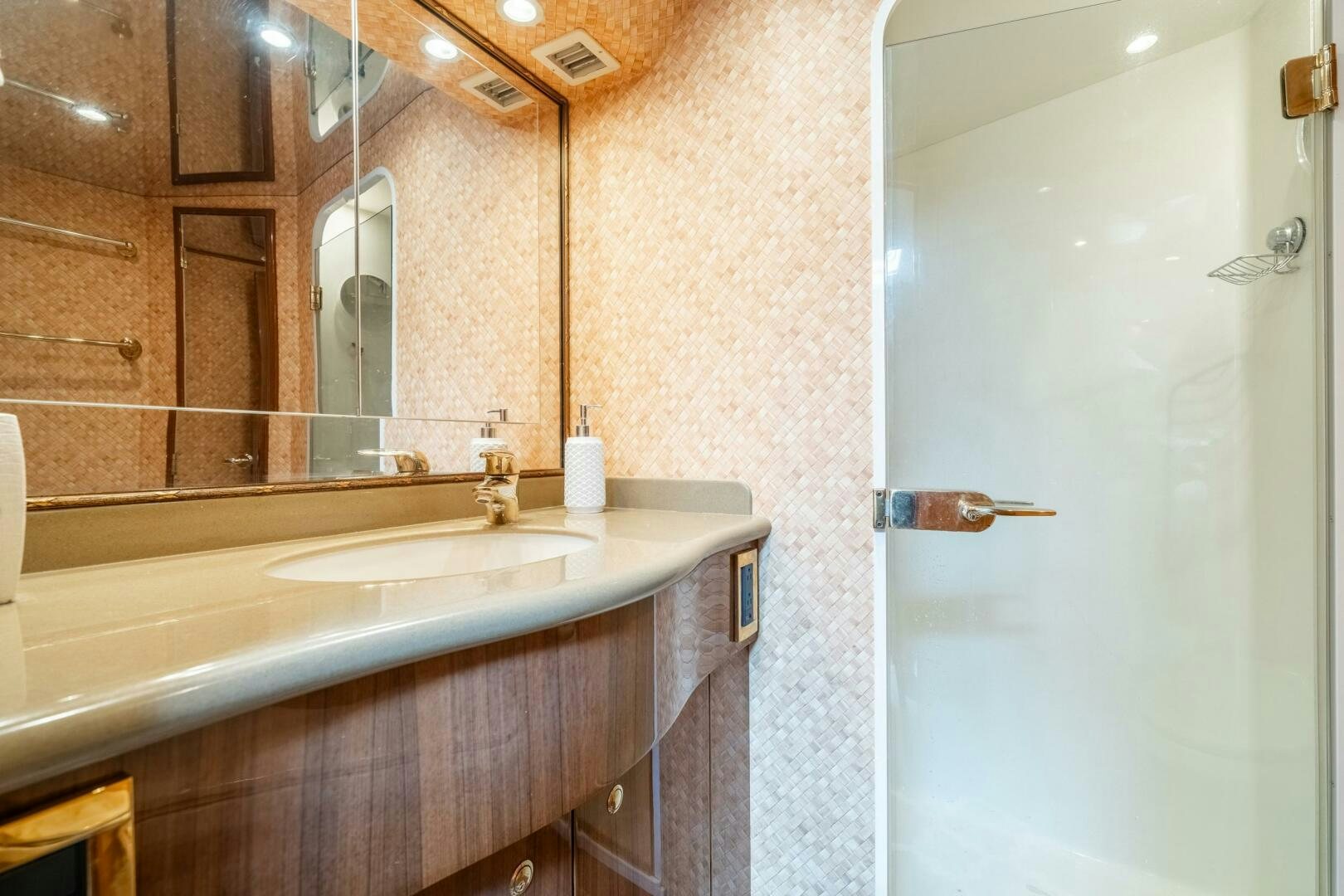 a bathroom with a sink and a mirror aboard W Yacht for Sale
