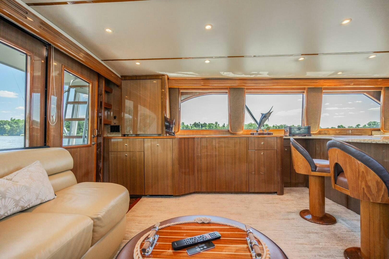 a living room with a wood table aboard W Yacht for Sale