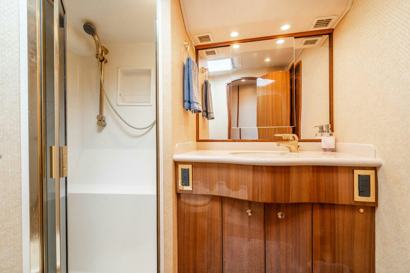 a bathroom with a large mirror aboard W Yacht for Sale