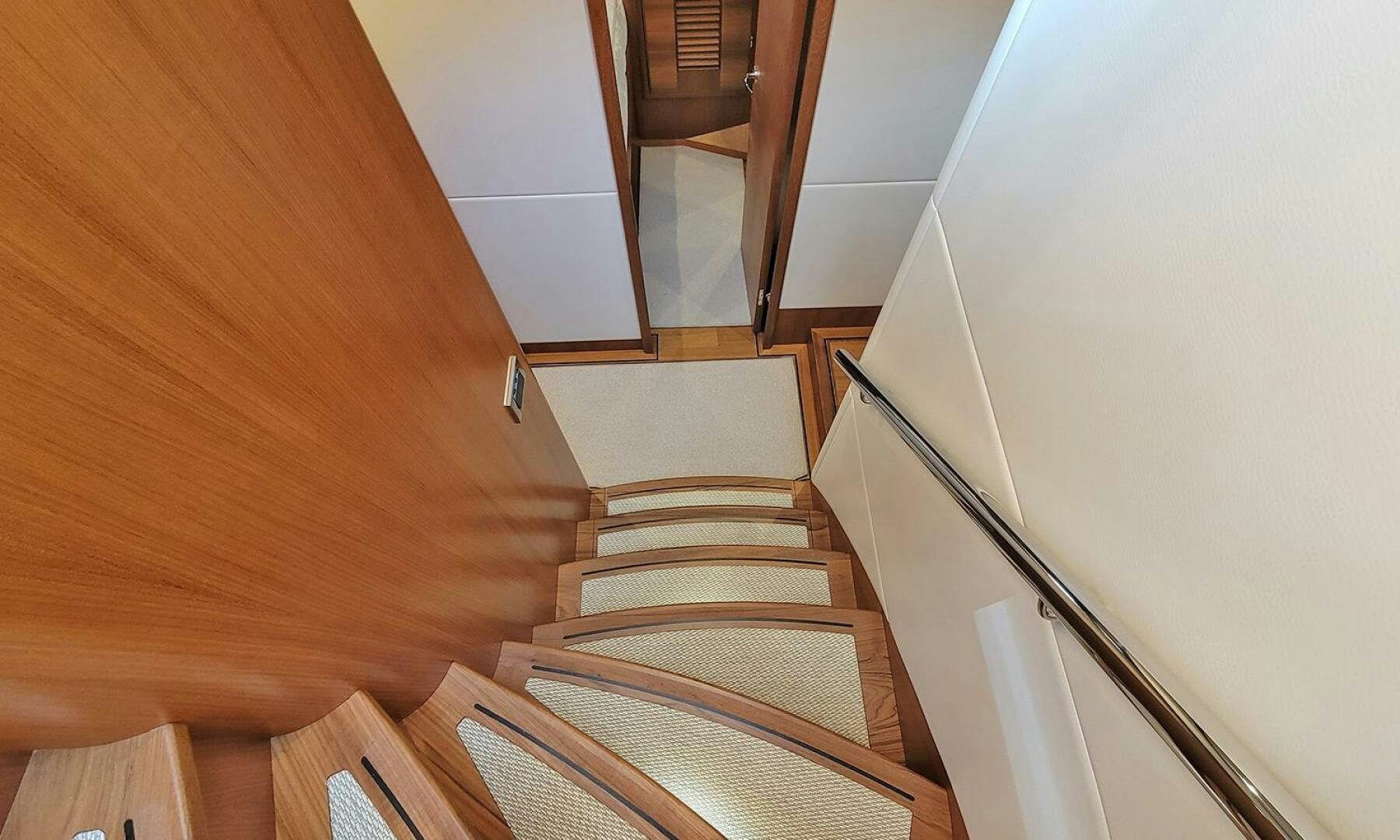 a staircase with a wood floor aboard OKIE Yacht for Sale