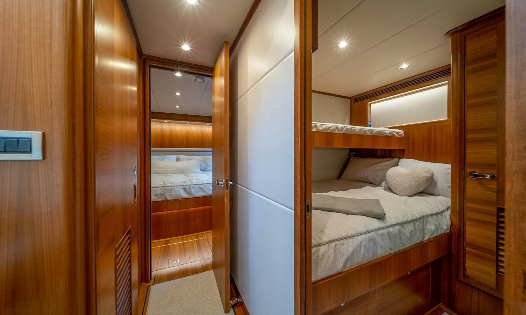 a room with a bed and a closet aboard OKIE Yacht for Sale