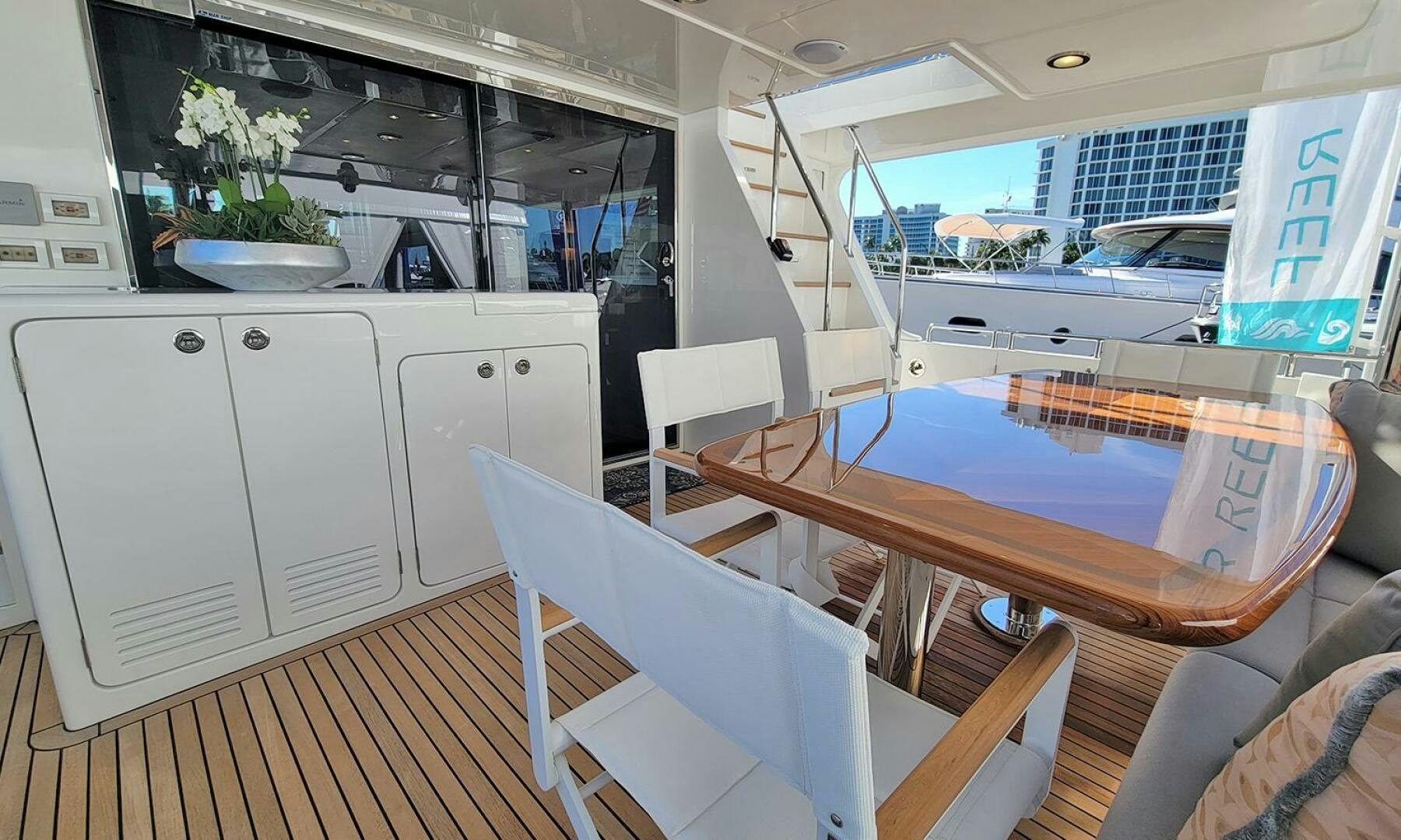 a room with a table and chairs aboard OKIE Yacht for Sale
