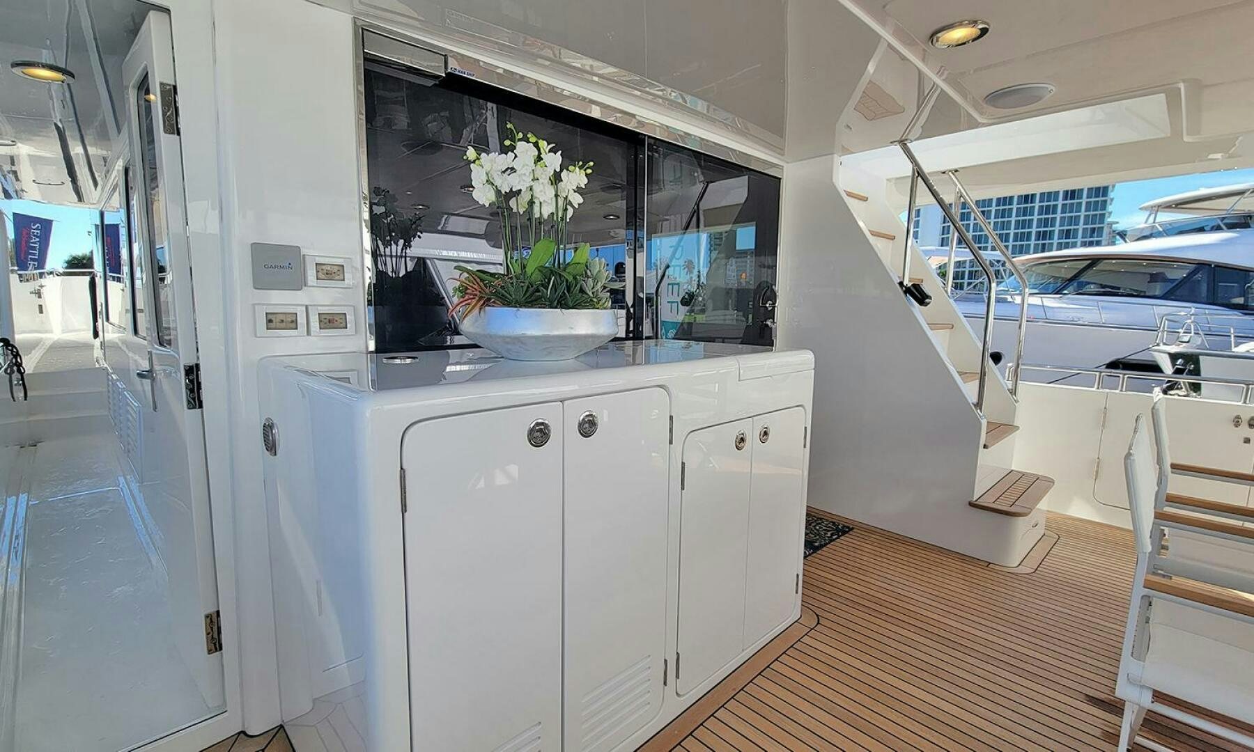 a kitchen with white cabinets aboard OKIE Yacht for Sale