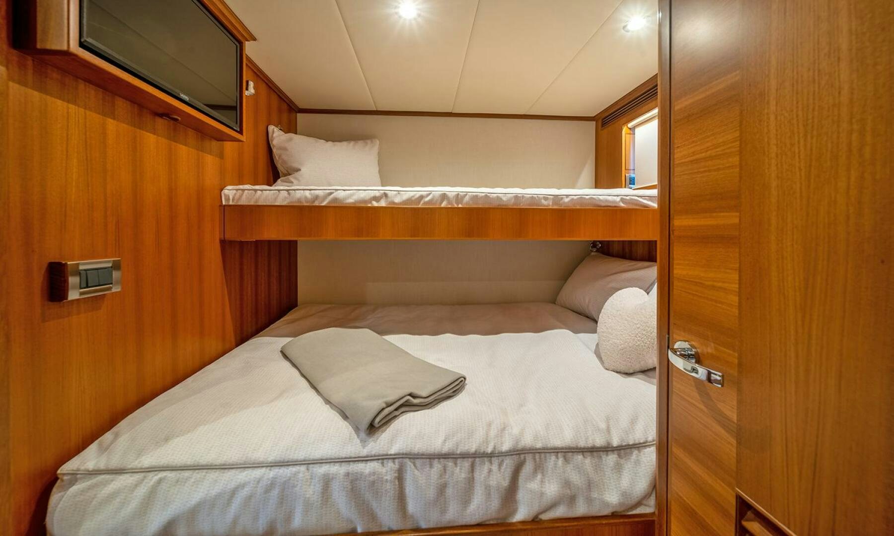 a bed with white sheets aboard OKIE Yacht for Sale
