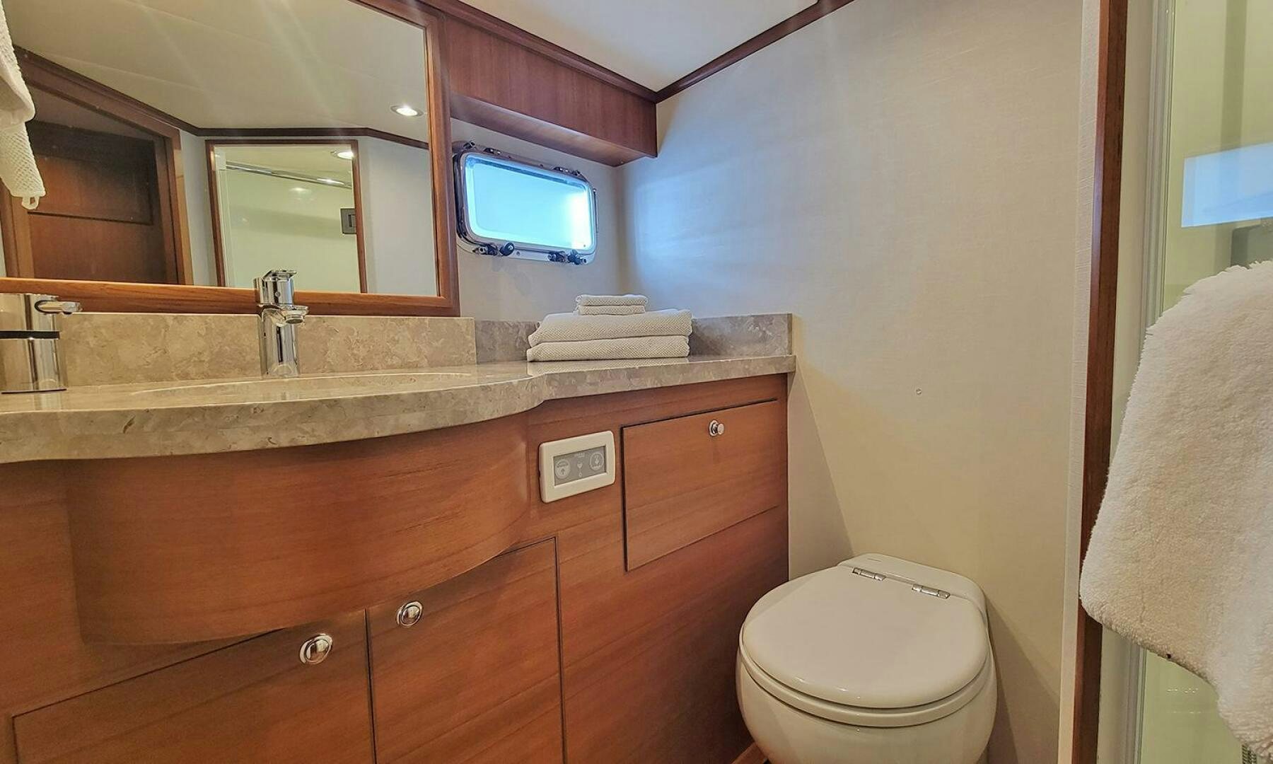 a bathroom with a sink and a toilet aboard OKIE Yacht for Sale