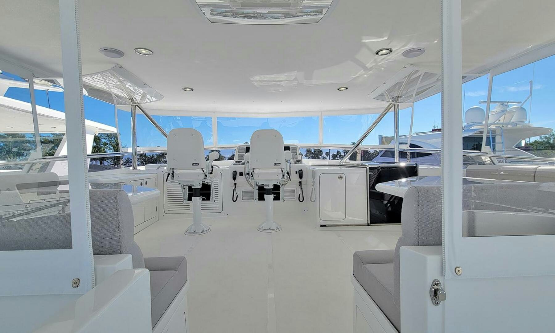 inside of a building with a glass ceiling and a white chair and a white chair and a blue aboard OKIE Yacht for Sale