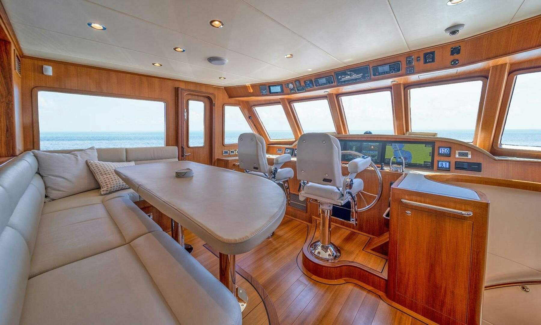 a train car with a table and chairs aboard OKIE Yacht for Sale