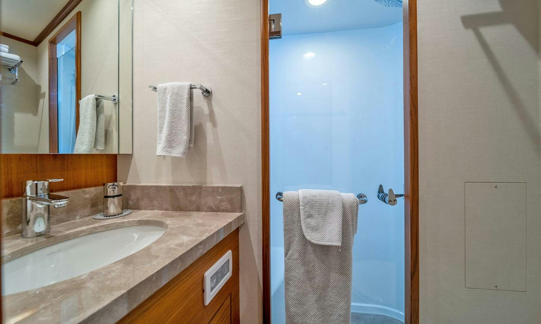 a bathroom with a sink and a mirror aboard OKIE Yacht for Sale