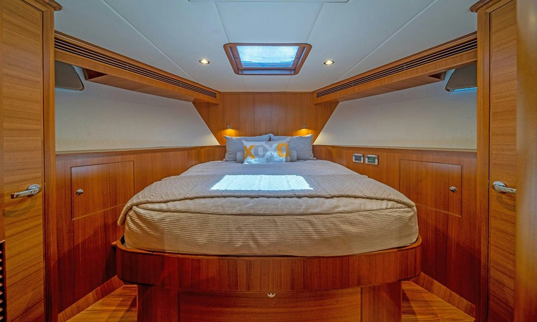 a bed in a room aboard OKIE Yacht for Sale