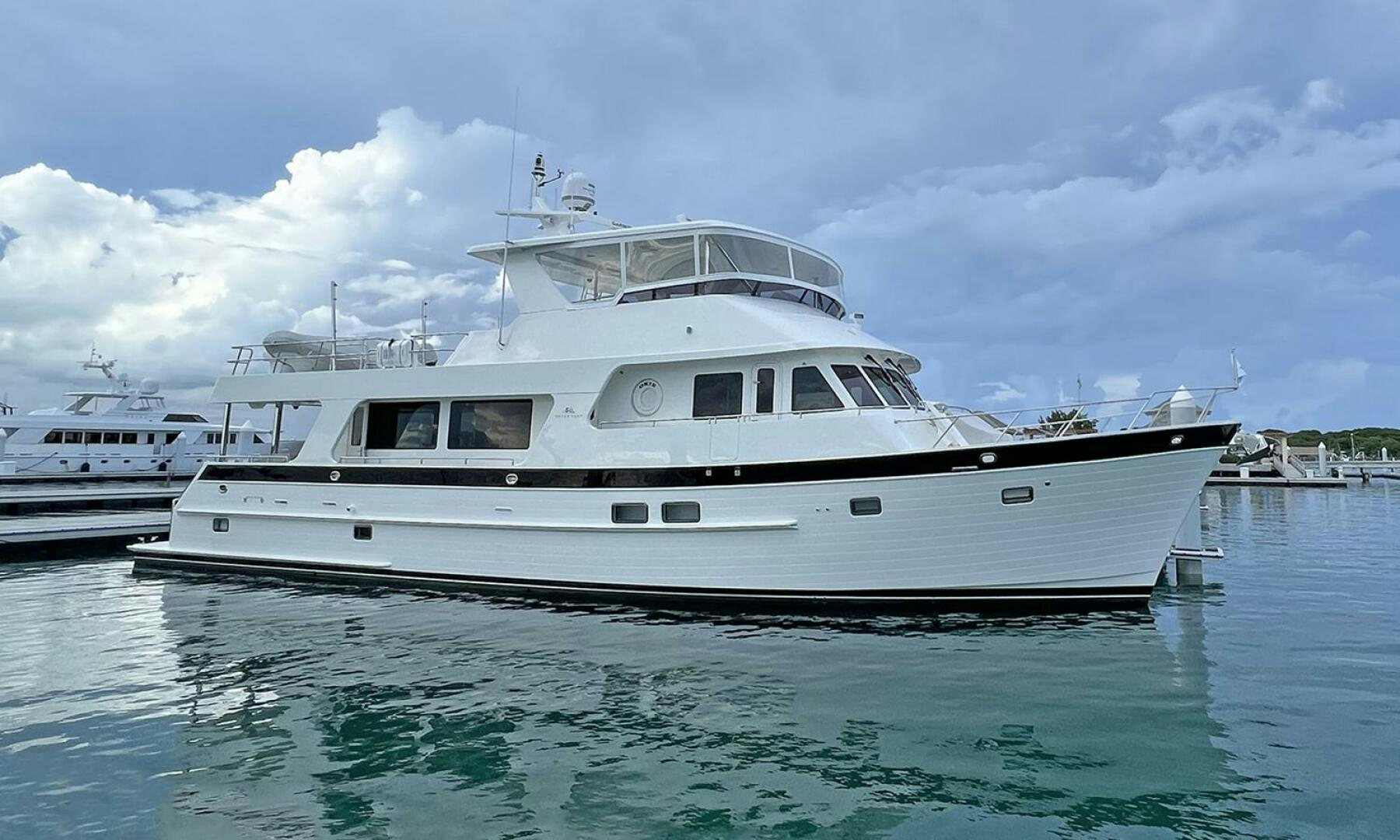 a white yacht in the water aboard OKIE Yacht for Sale