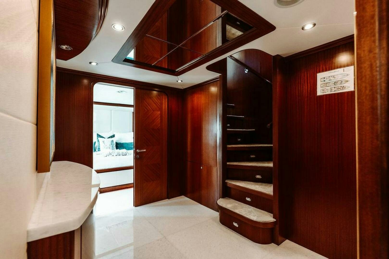 a room with a wood door and a wood bench aboard BEACHFRONT Yacht for Sale