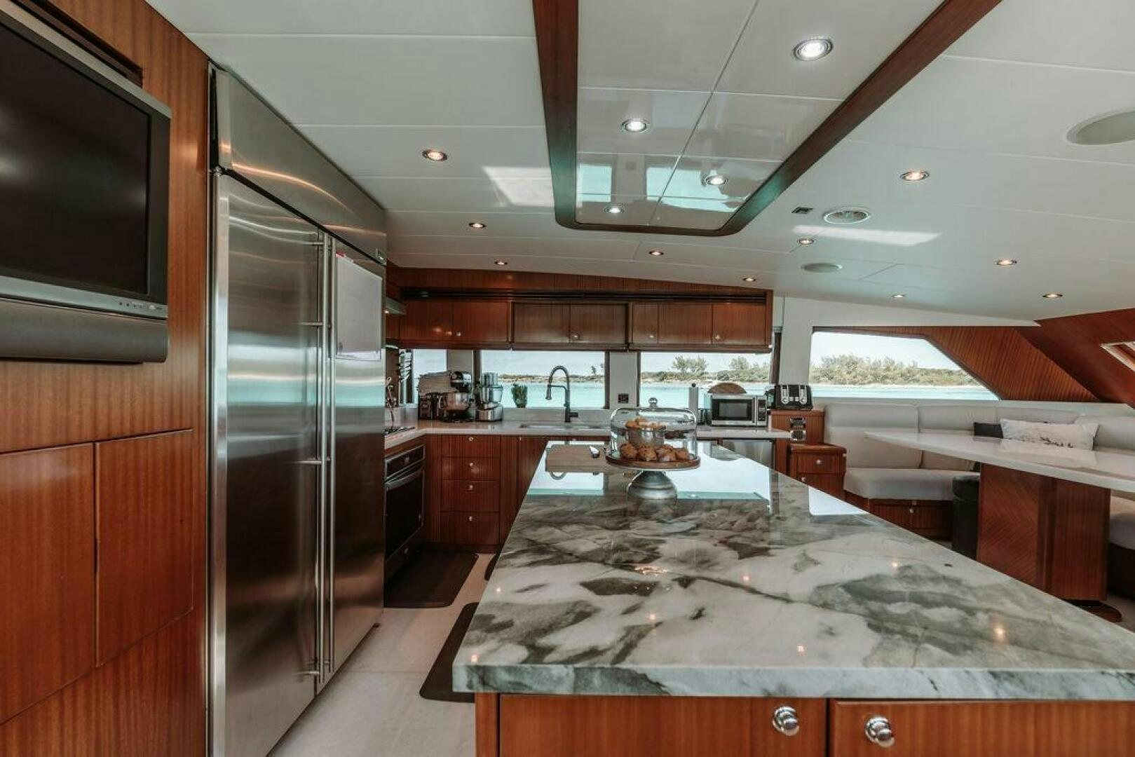 a large kitchen with marble counters aboard BEACHFRONT Yacht for Sale