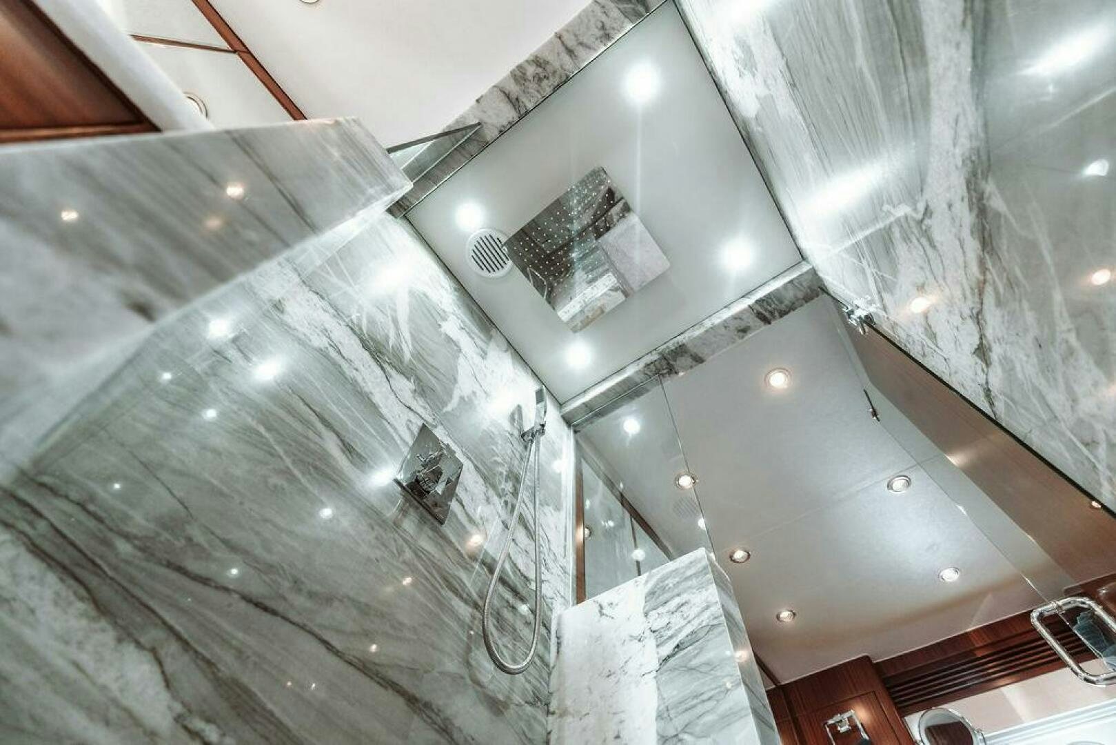 a silver car with a large mirror aboard BEACHFRONT Yacht for Sale