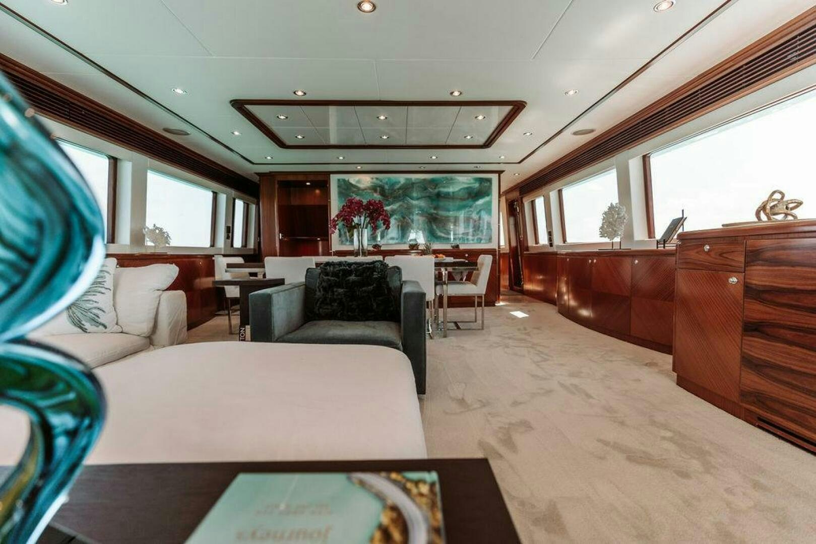 a large living room with a large window aboard BEACHFRONT Yacht for Sale