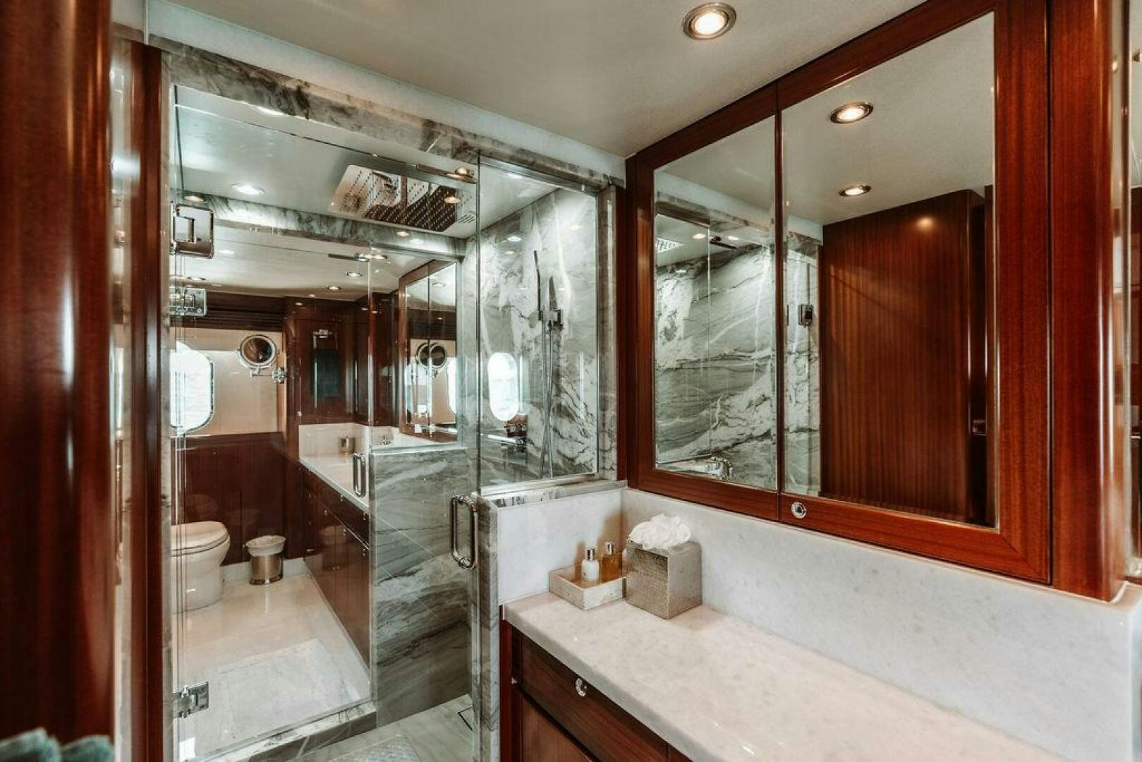 a bathroom with a large mirror aboard BEACHFRONT Yacht for Sale