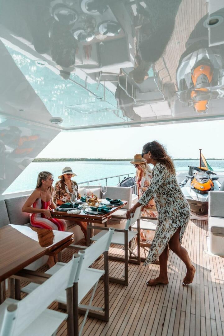 a person standing on a deck aboard BEACHFRONT Yacht for Sale