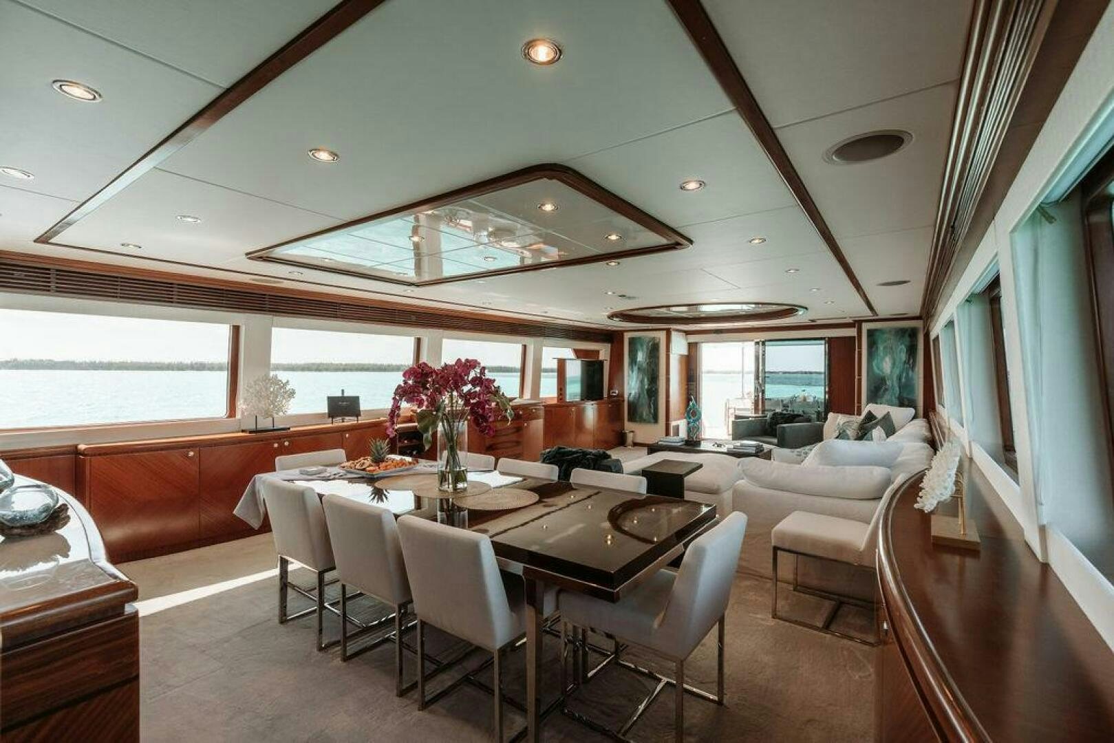 a large dining room with a large table and chairs aboard BEACHFRONT Yacht for Sale