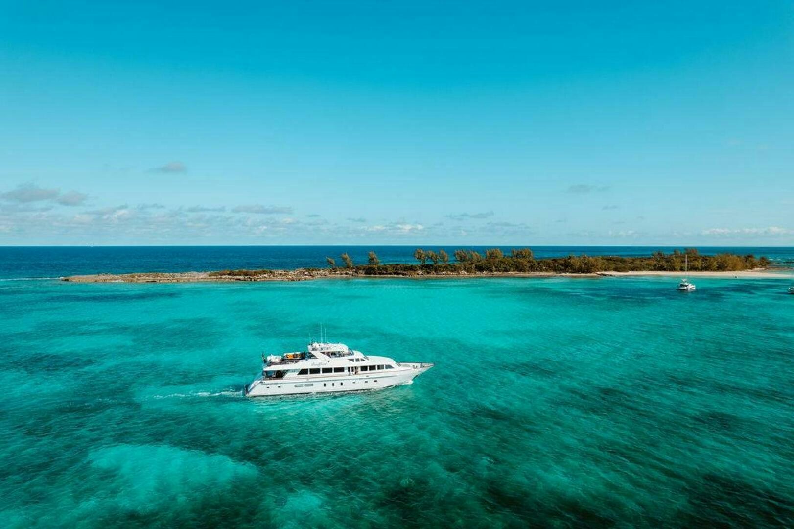 a boat in the water aboard BEACHFRONT Yacht for Sale