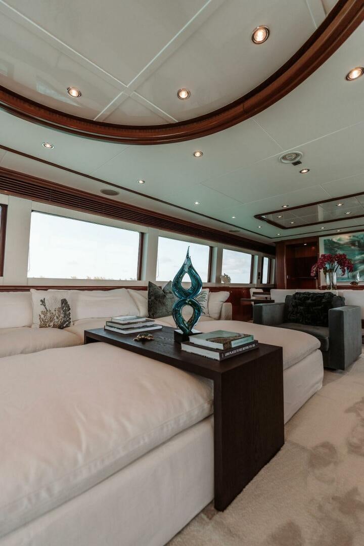 a living room with a couch and a coffee table aboard BEACHFRONT Yacht for Sale