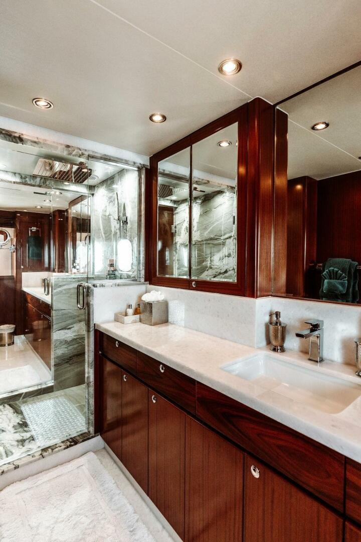 a bathroom with a large mirror aboard BEACHFRONT Yacht for Sale