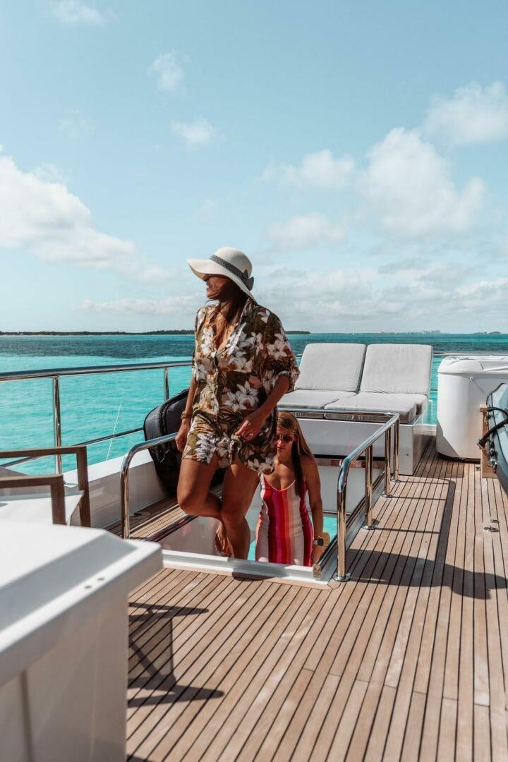 a person sitting on a bench aboard BEACHFRONT Yacht for Sale