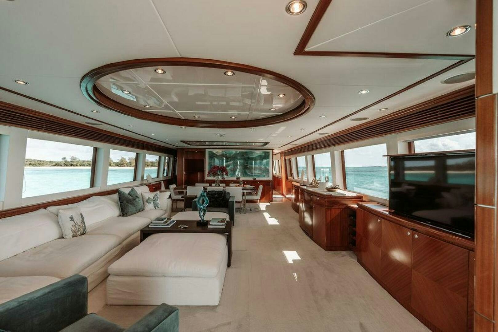 a large living room with a large open window aboard BEACHFRONT Yacht for Sale