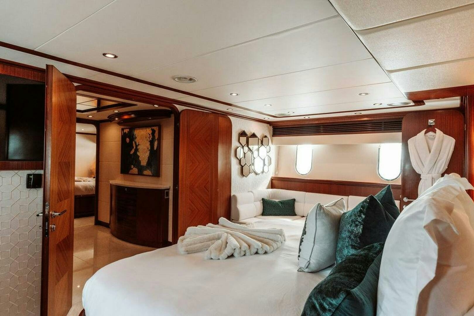 a room with a bed and a wood door aboard BEACHFRONT Yacht for Sale