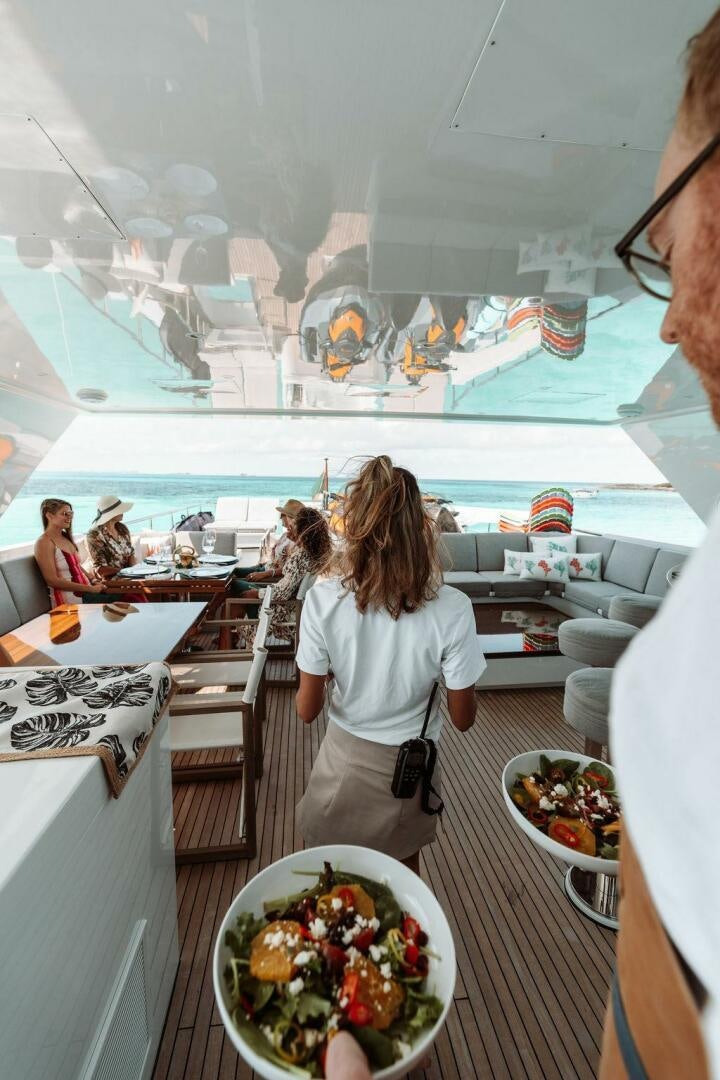 a group of people in a restaurant aboard BEACHFRONT Yacht for Sale