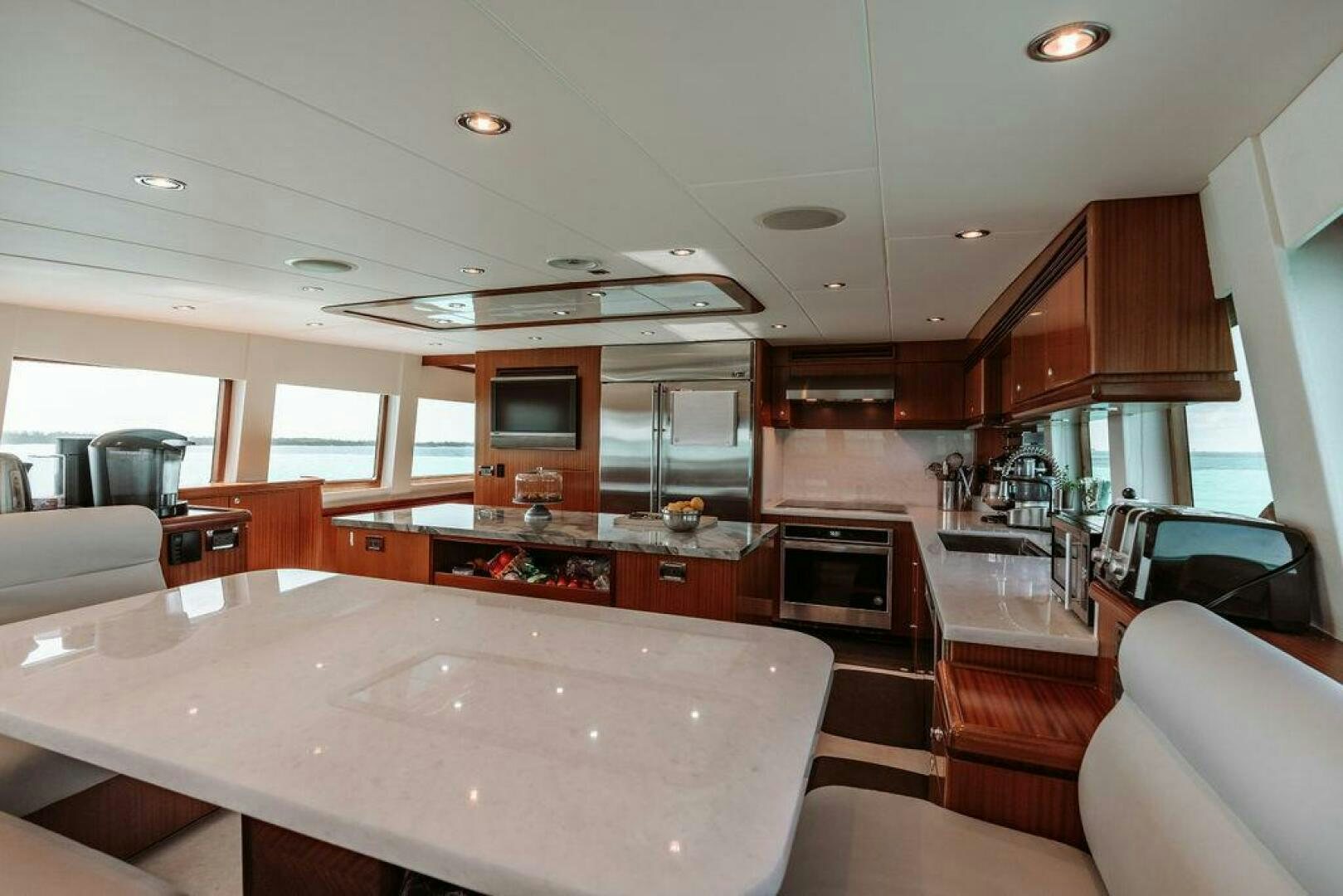 a large kitchen with a large island aboard BEACHFRONT Yacht for Sale
