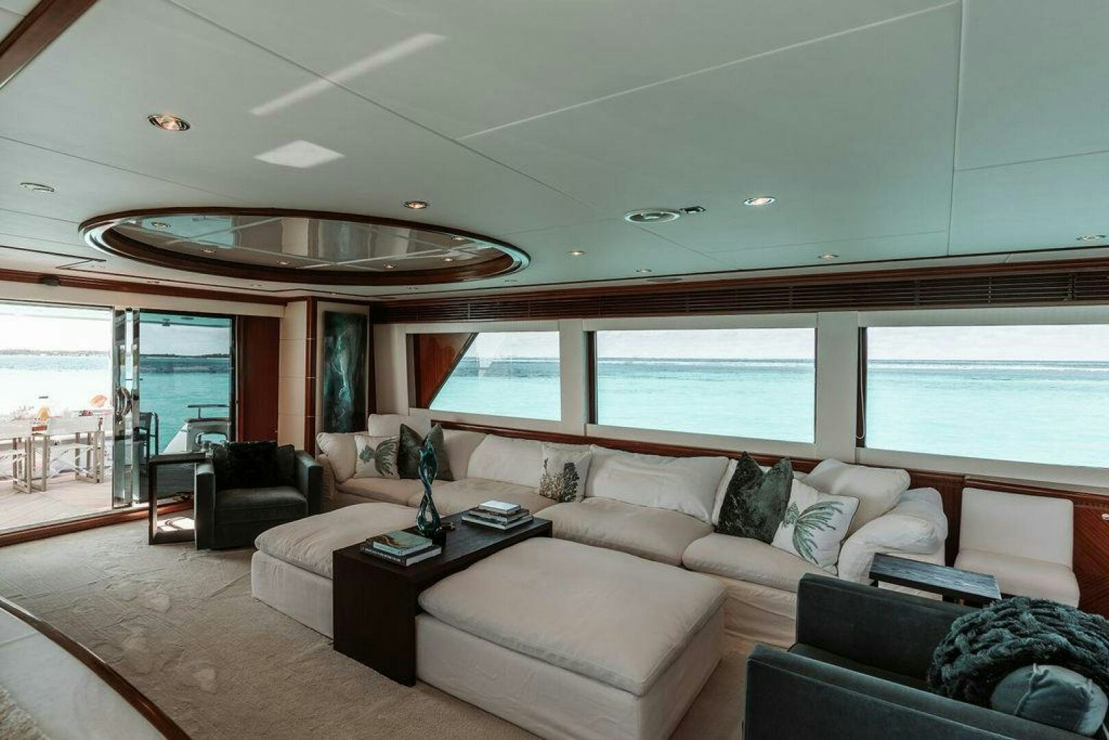 a living room with a large window aboard BEACHFRONT Yacht for Sale
