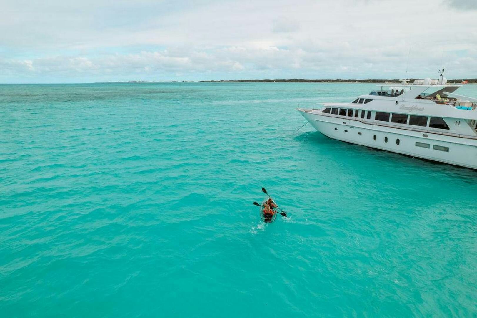 a person swimming in the ocean aboard BEACHFRONT Yacht for Sale