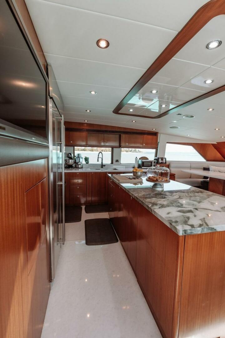 a kitchen with a large island aboard BEACHFRONT Yacht for Sale