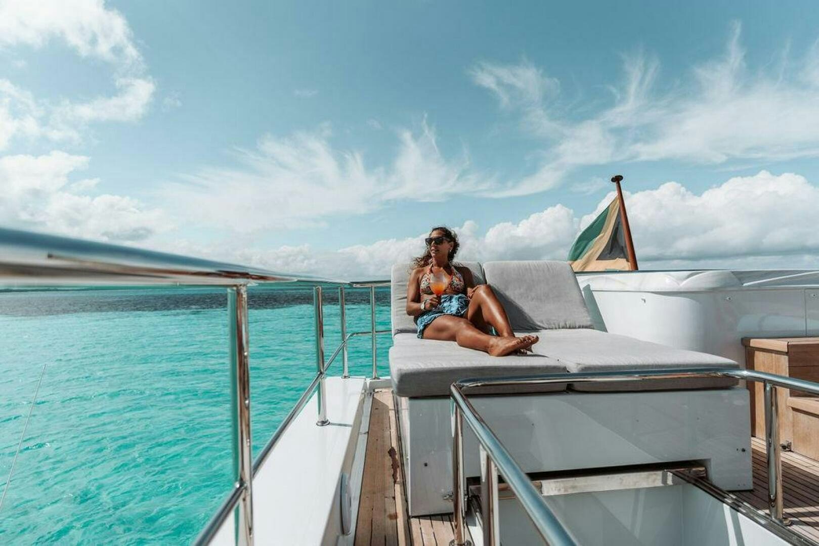 a person sitting on a boat aboard BEACHFRONT Yacht for Sale