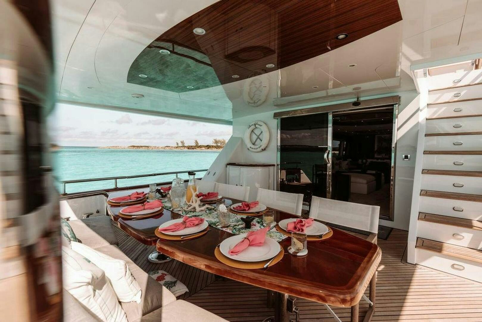 a dining table in a room aboard BEACHFRONT Yacht for Sale