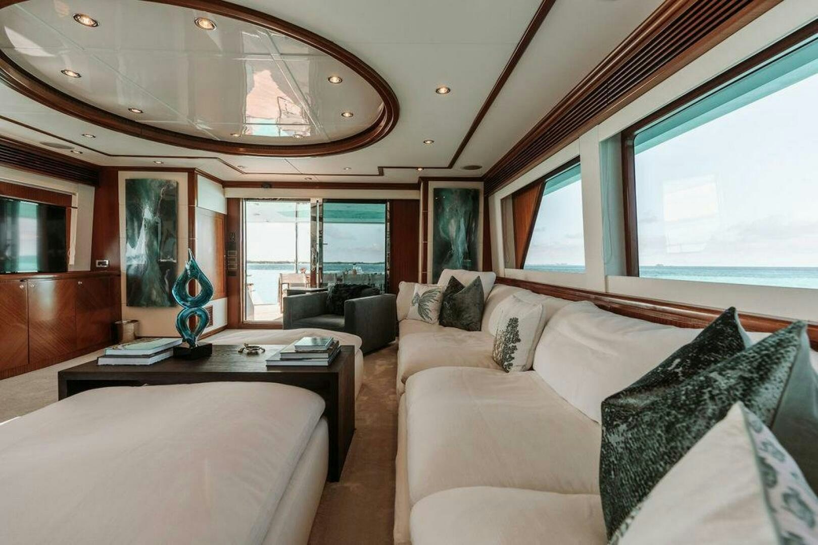 a living room with a couch and a coffee table aboard BEACHFRONT Yacht for Sale