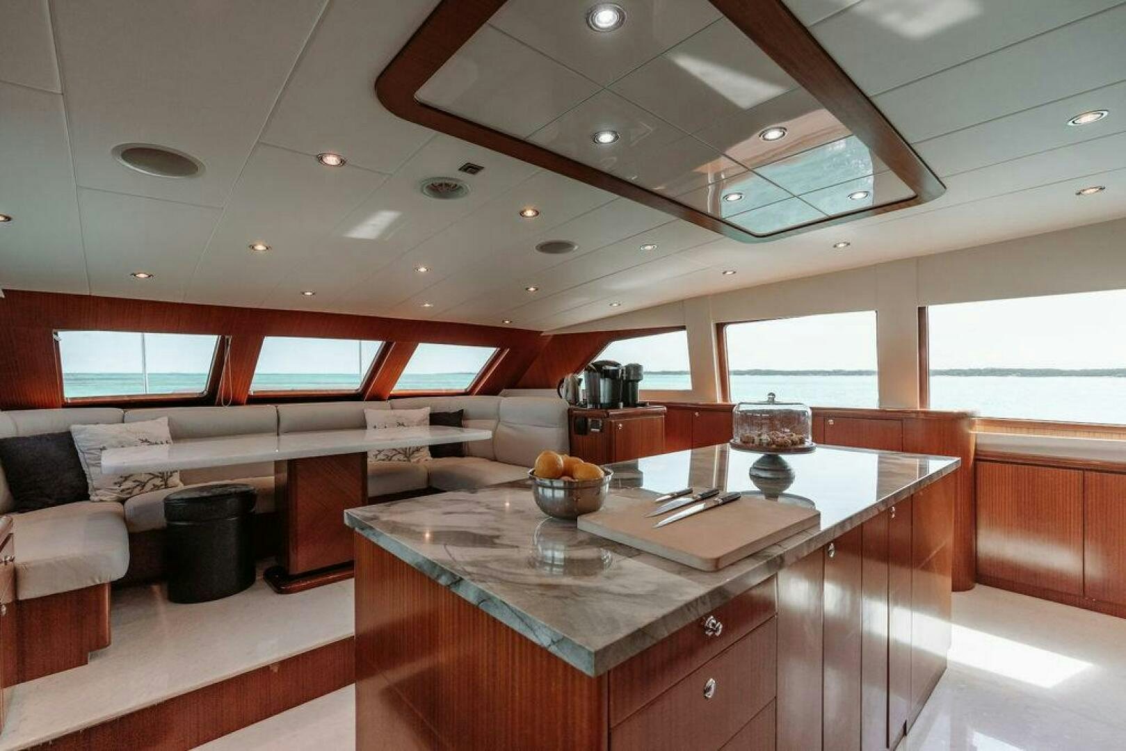 a kitchen with a large island aboard BEACHFRONT Yacht for Sale