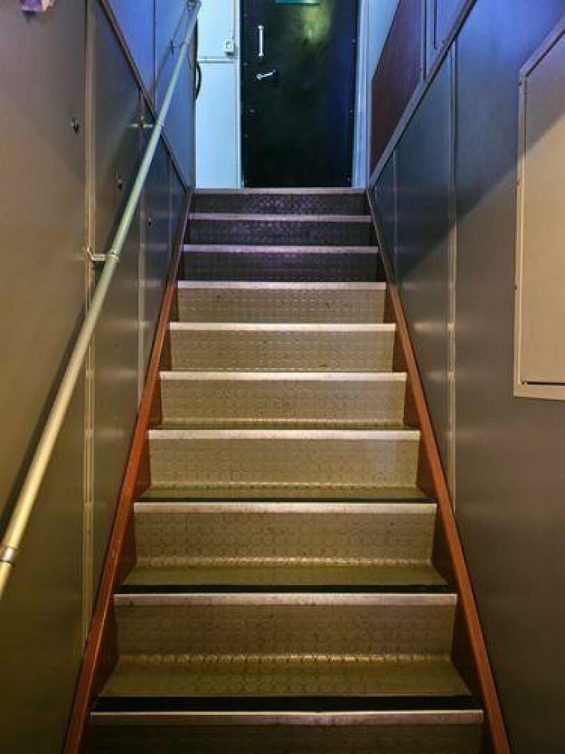 a set of stairs in a building aboard JADEN SUN Yacht for Sale