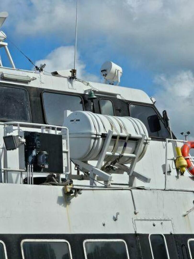 a white boat with a large piece of equipment on it aboard JADEN SUN Yacht for Sale