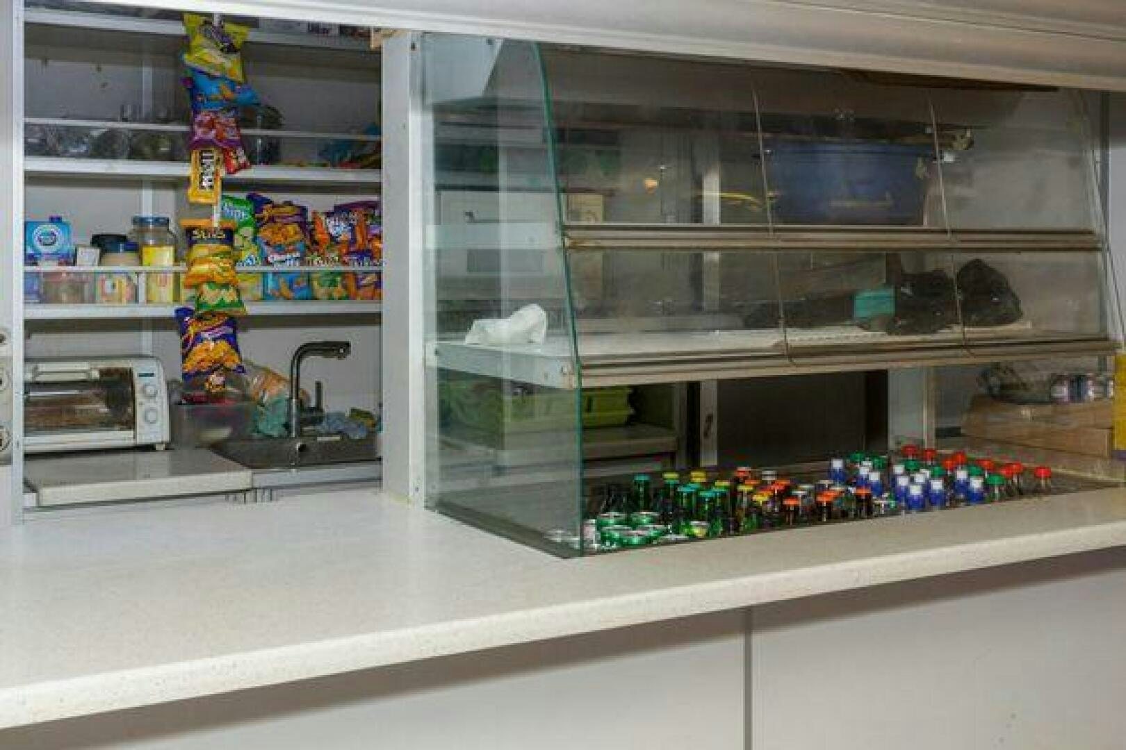 a shelf with a variety of items on it aboard JADEN SUN Yacht for Sale