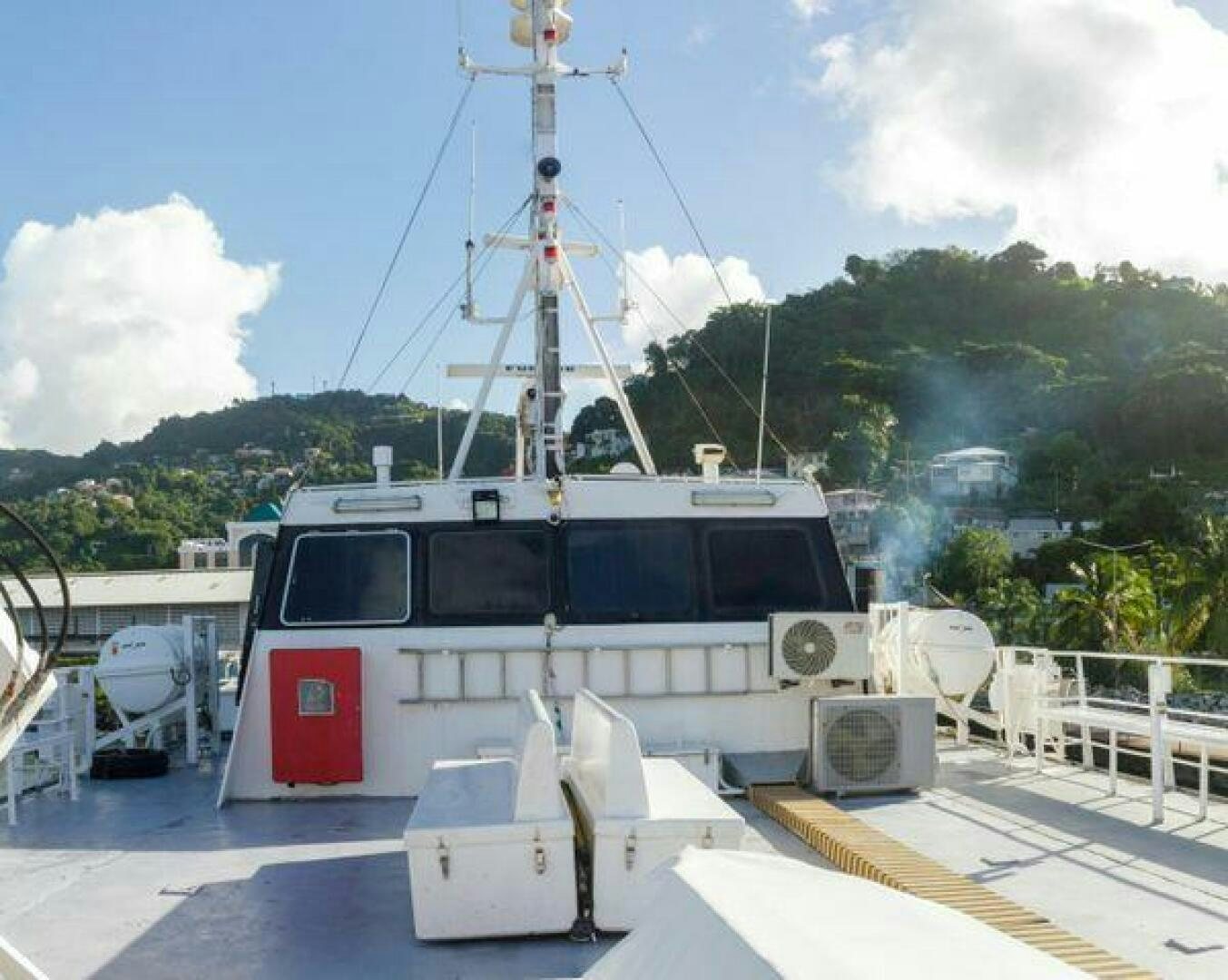 a white boat on a dock aboard JADEN SUN Yacht for Sale